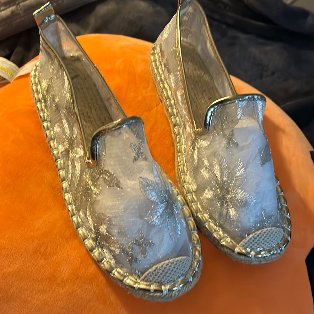 Pair of see through flats with flowers never worn.